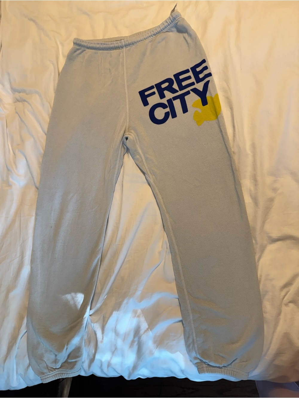 freecity Pale Blue Pants with Navy FREE CITY Logo and Yellow Accent